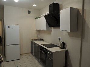 Comfort Apartment, 1 Bedroom | Private kitchen | Fridge, microwave