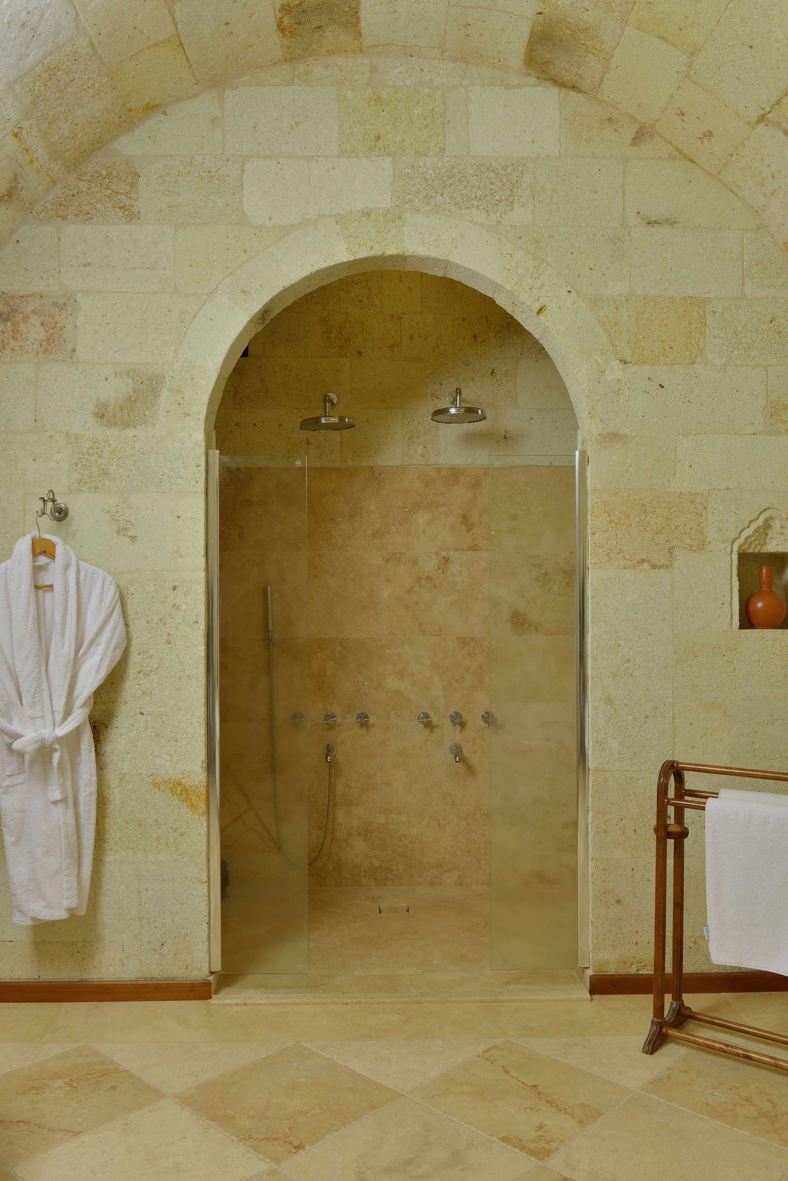 luxury stone - arch house | bathroom shower