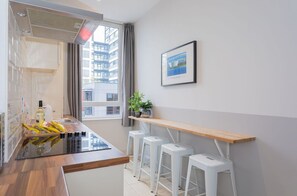 Apartamento Deluxe, baño privado (Two Bedroom) | Cocina compartida