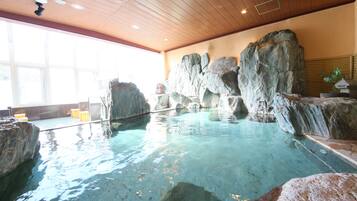 Relax by the natural rock formation pool surrounded by a waterfall effect.