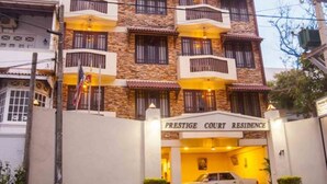 A multi-story building with a sign reading "Prestige Court Residence." - The Prestige Court Residence (Mount Lavinia)