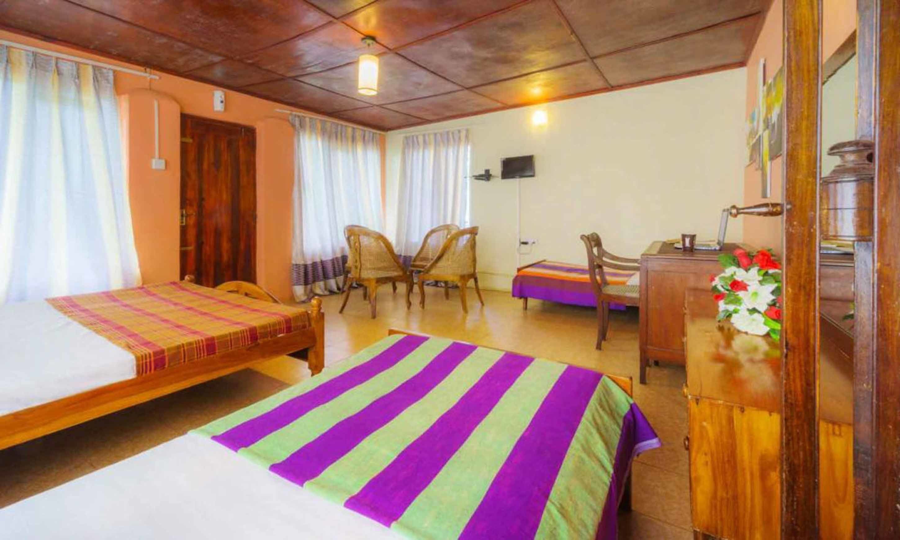 Deluxe Triple Room, Multiple Beds, Private Bathroom, Hill View | Desk, iron/ironing board, free WiFi, bed sheets