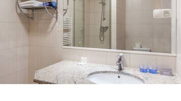 Shower, free toiletries, hair dryer, slippers