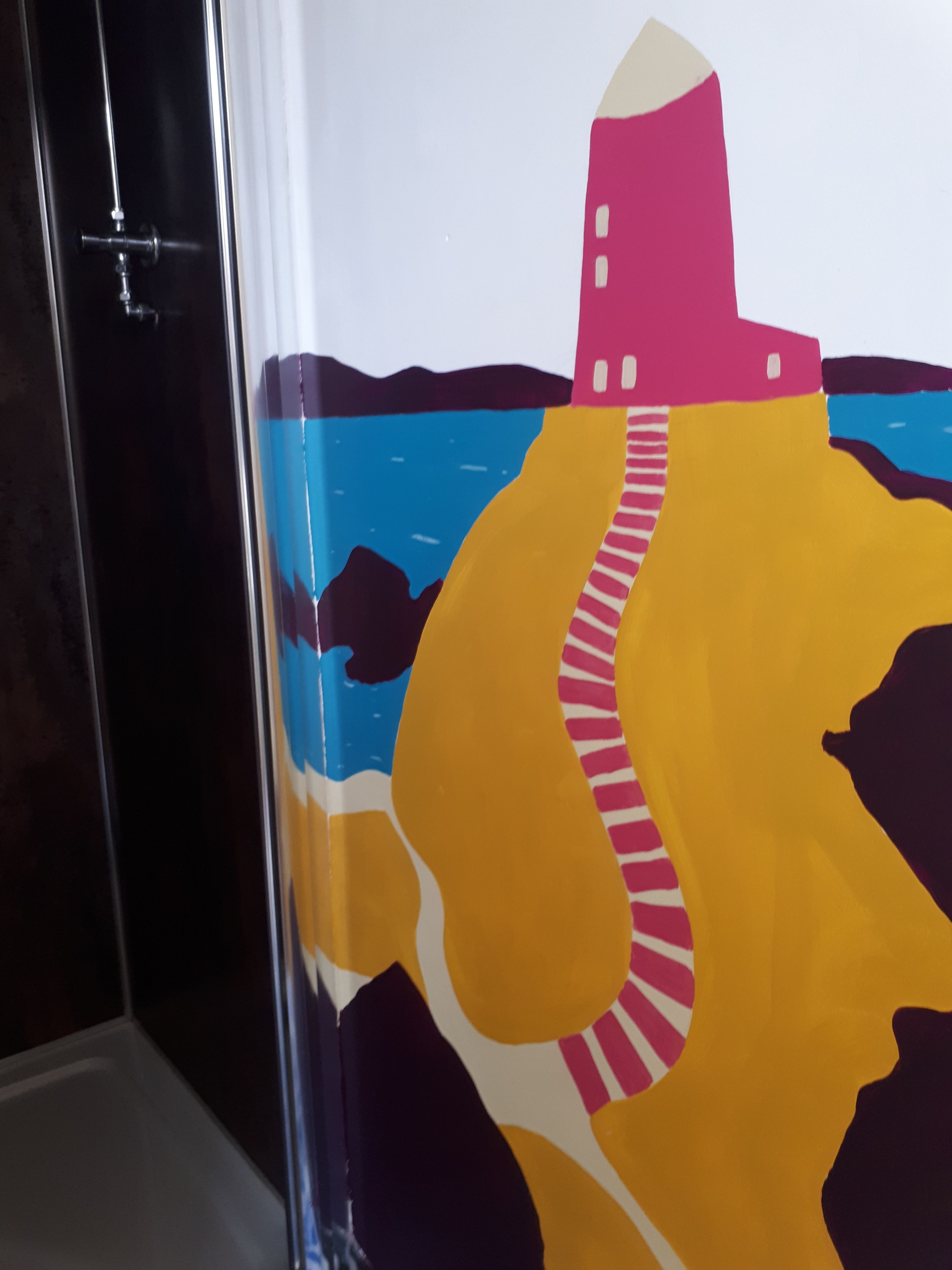 A colorful mural with abstract shapes and a building silhouette.