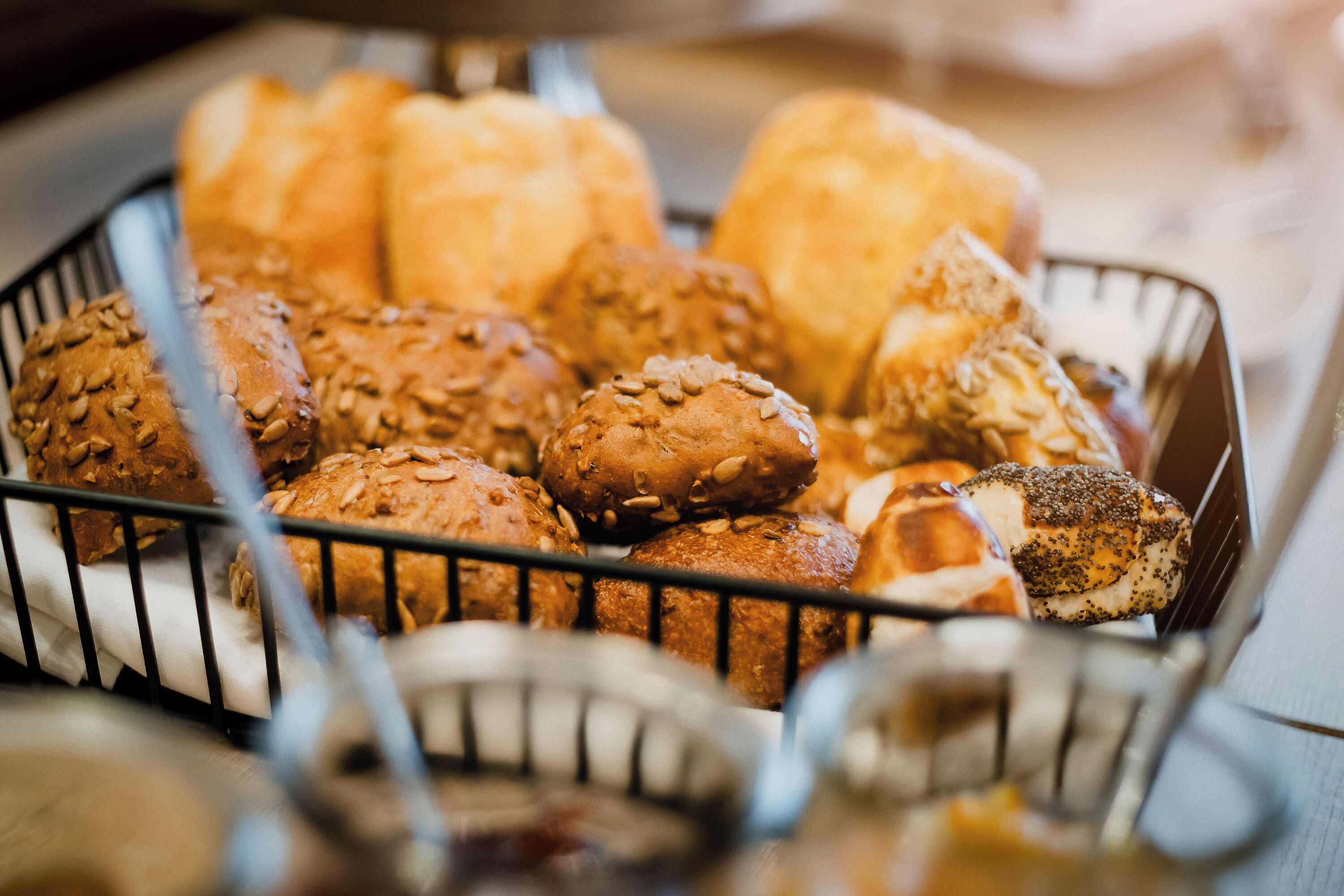 A basket of various breads and pastries.
