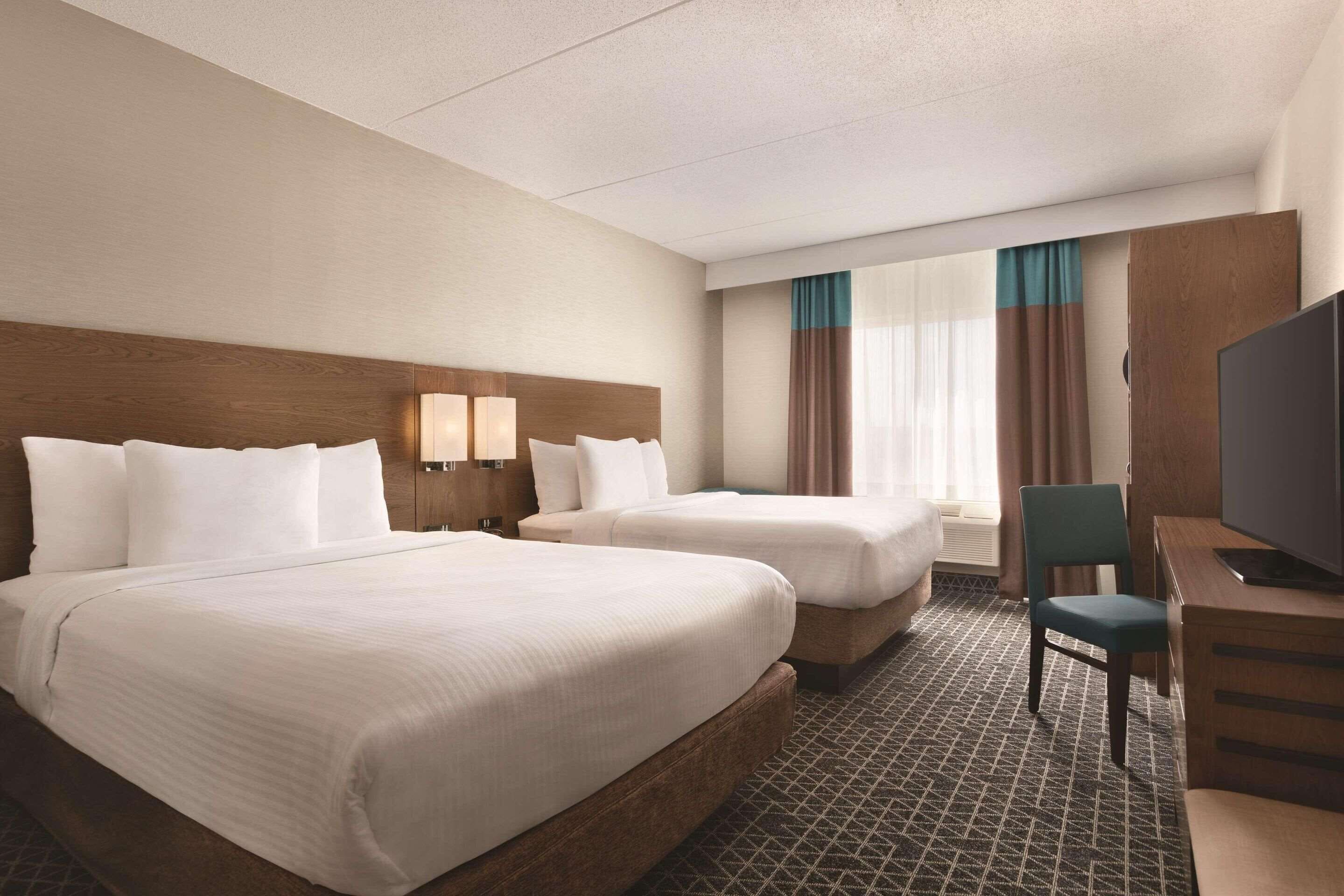 Room, 2 Queen Beds, Non Smoking | Down duvets, in-room safe, desk, blackout curtains