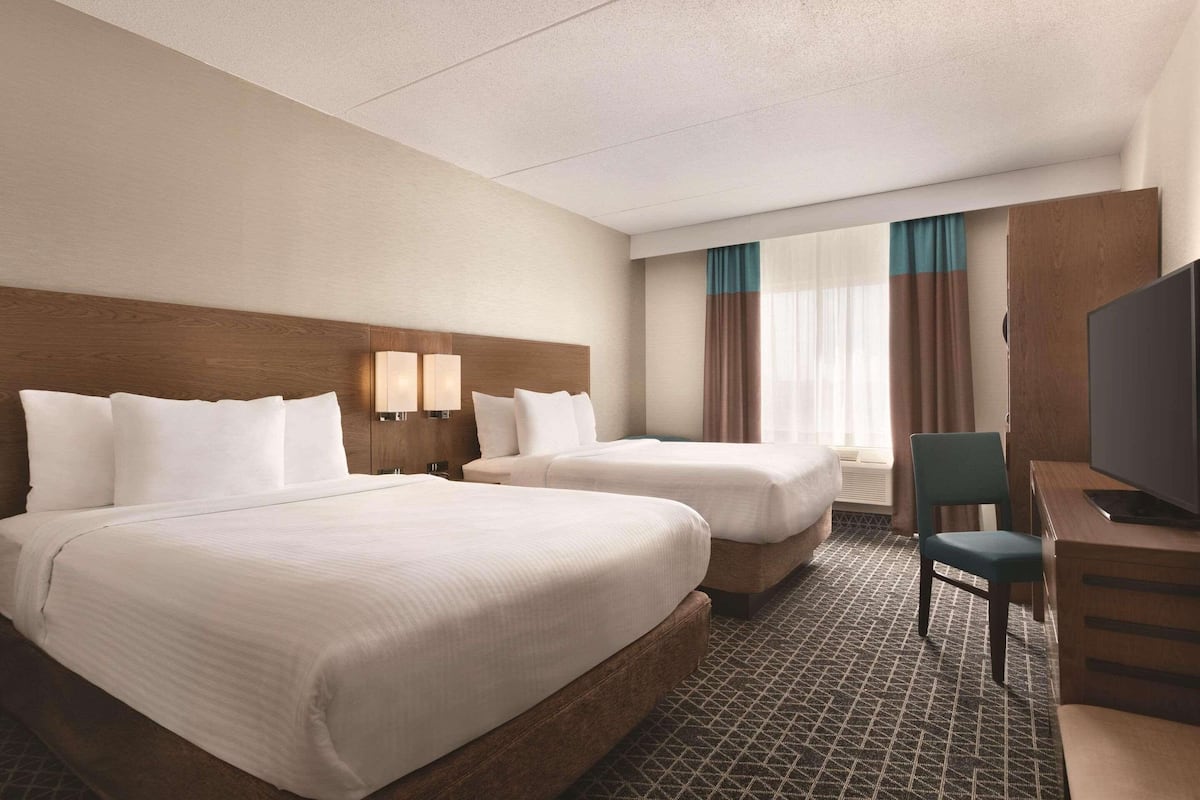 Room, 2 Queen Beds, Non Smoking | Down duvets, in-room safe, desk, blackout curtains