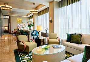 A modern hotel lobby with a seating area, a dining space, and a large window with curtains. - Live! Casino & Hotel Maryland (Hanover)