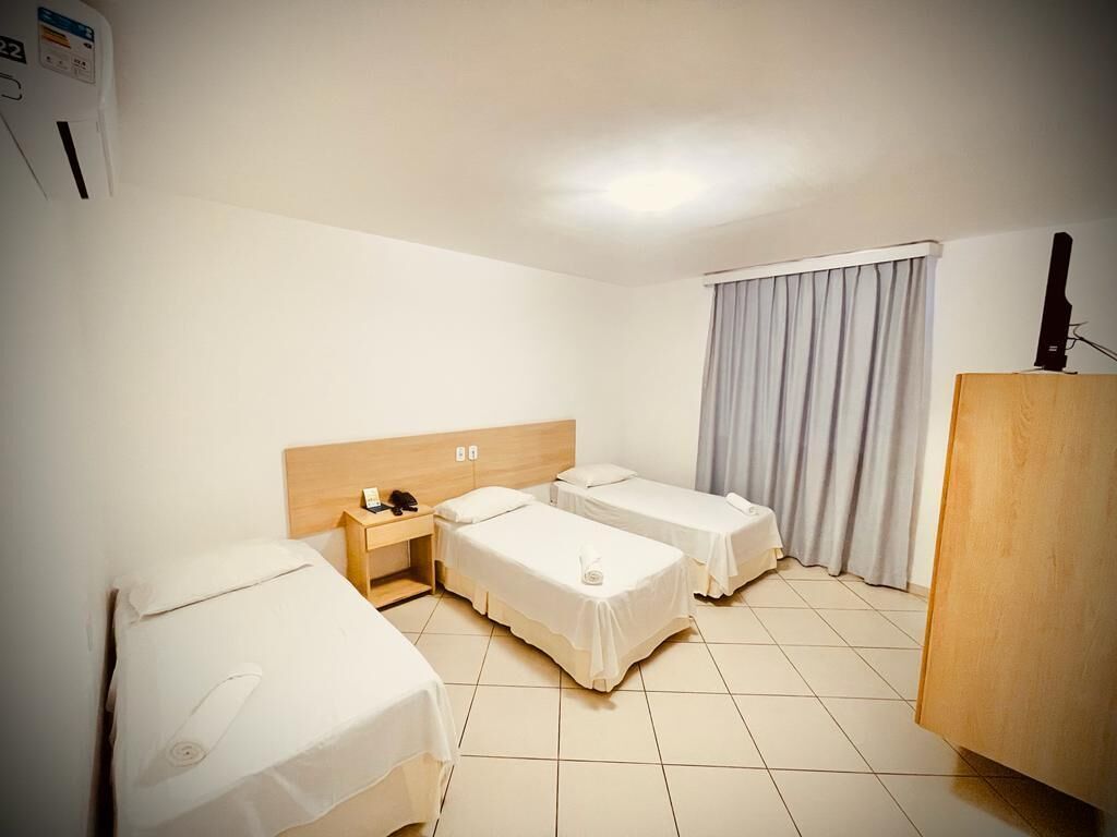 deluxe triple room | minibar, desk, blackout curtains, iron/ironing board