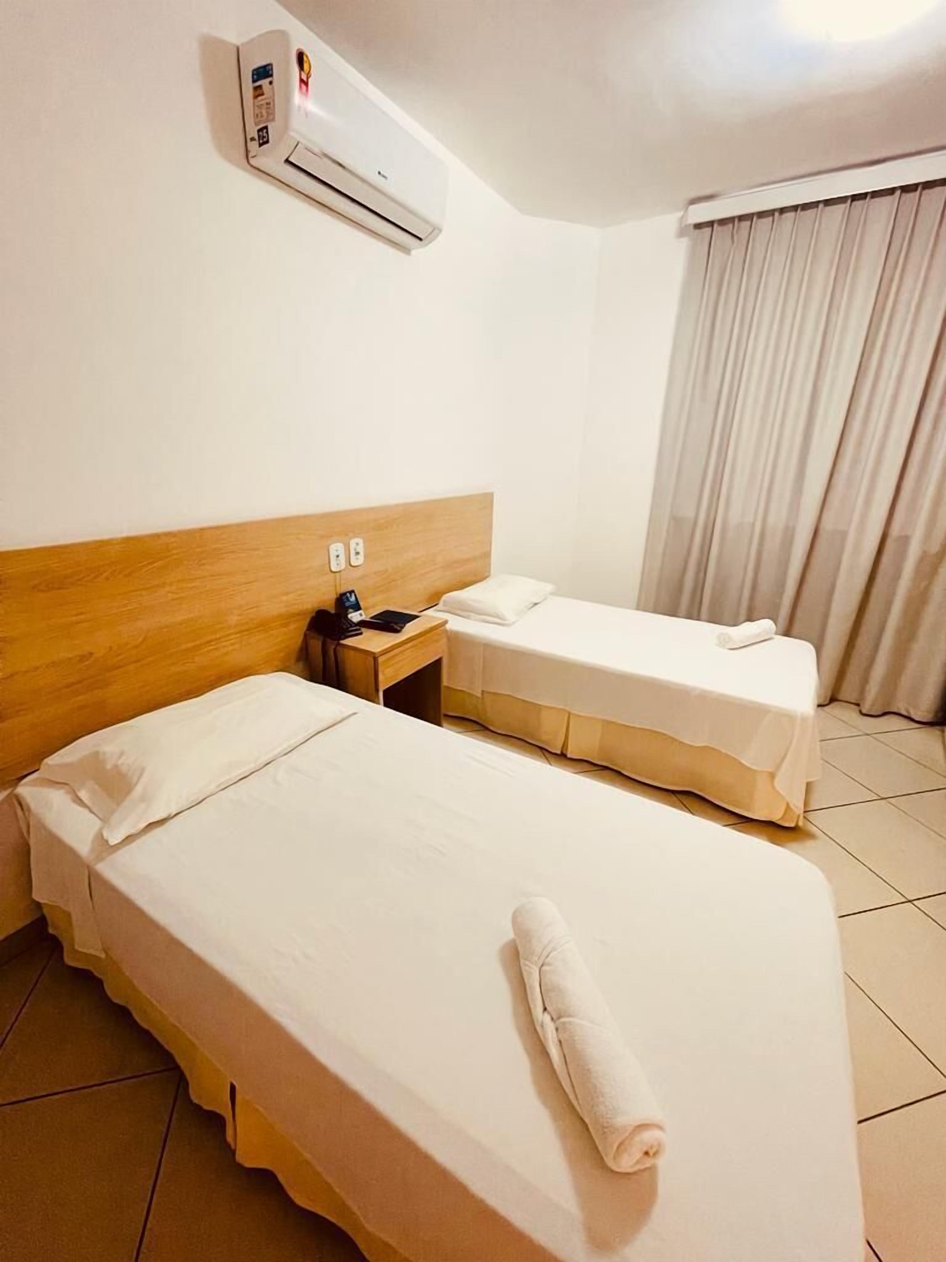 deluxe single room | minibar, desk, blackout curtains, iron/ironing board