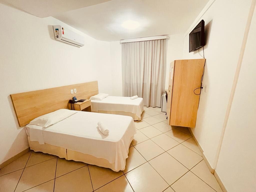 deluxe single room | minibar, desk, blackout curtains, iron/ironing board