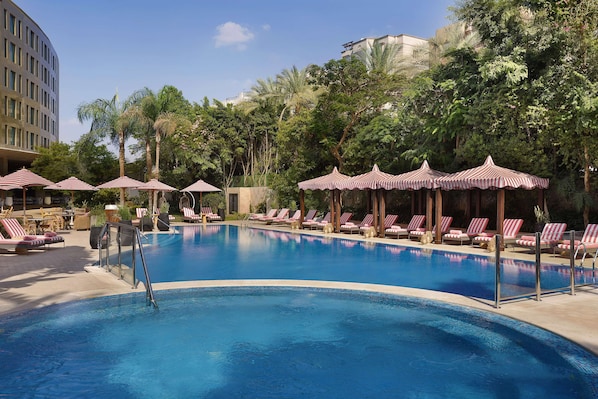 Outdoor pool, open 7:00 AM to 5:00 PM, free pool cabanas, pool umbrellas