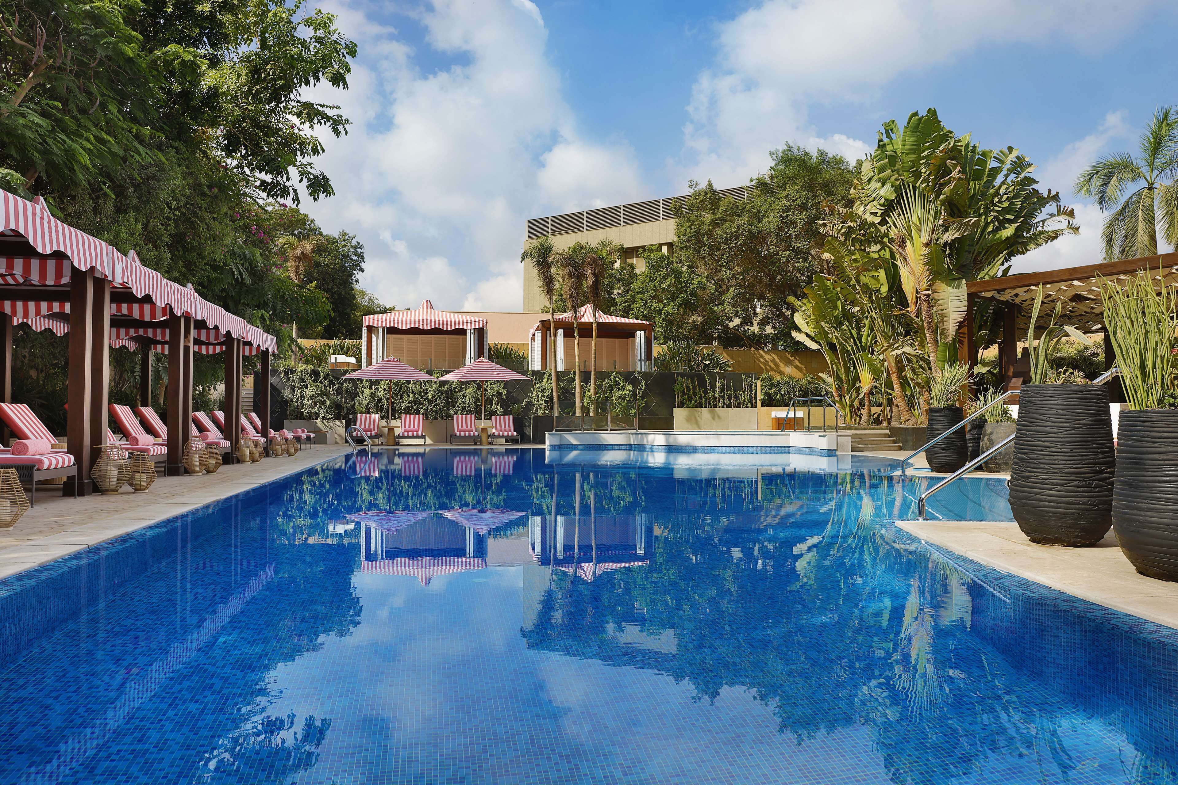 Outdoor pool, open 7:00 AM to 5:00 PM, free cabanas, pool umbrellas