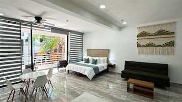 Luxury Suite, 1 King Bed with Sofa bed, Balcony, City View | Laptop workspace, free cribs/infant beds, free WiFi, bed sheets