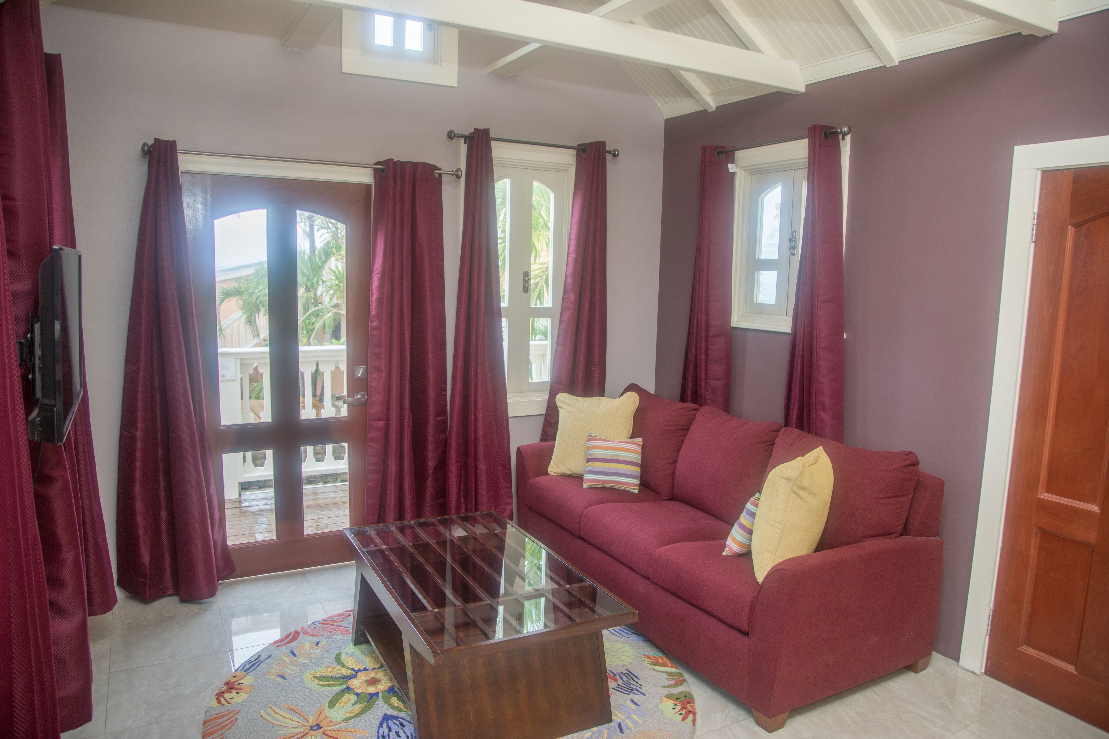 premium studio suite, 1 king bed, balcony, pool view | living area | tv