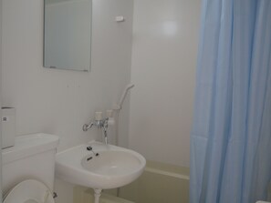 A bathroom with a white sink, a mirror, a toilet, and a shower curtain. - GUEST HOUSE SONOMAMA - Hostel (Kofu)