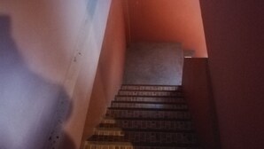 A staircase with a handrail and a landing area. - Rim Khuan Resort (Khuan Khanun)