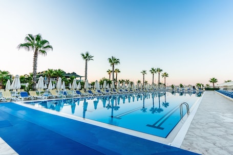 Indoor pool, seasonal outdoor pool, pool umbrellas, sun loungers
