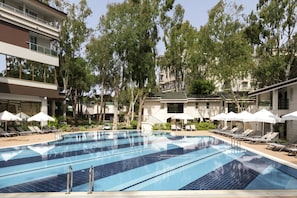 Indoor pool, seasonal outdoor pool, pool umbrellas, pool loungers