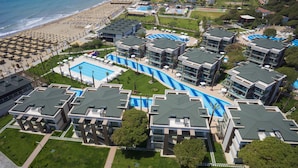 A resort with multiple swimming pools, a beach, and modern buildings. - TUI MAGIC LIFE Masmavi - All inclusive (Serik)