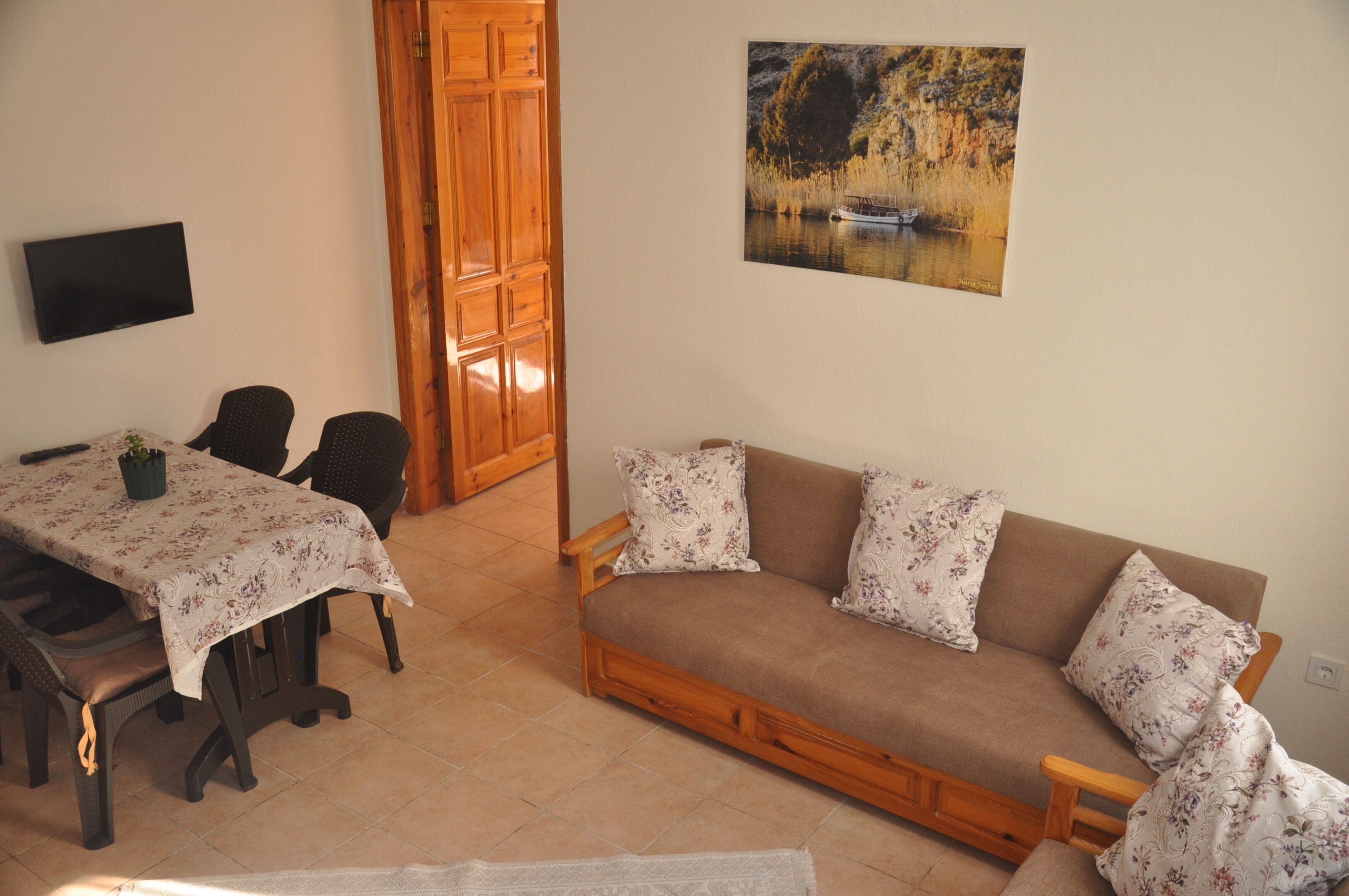 family apartment | living area | 61-cm lcd tv with satellite channels, tv