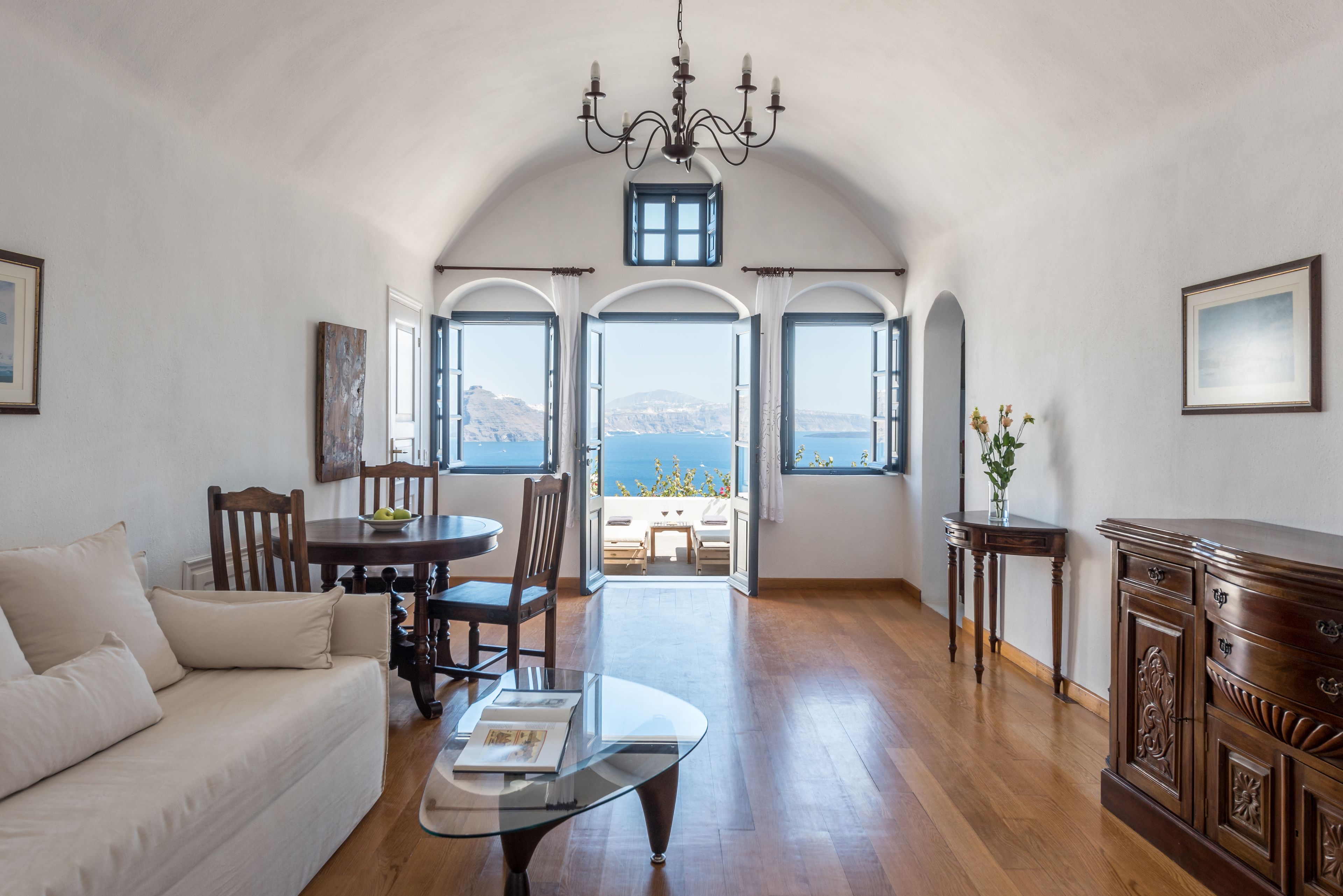 Suite, Outdoor Jetted Tub, Caldera View (Captain's) | Living area | IPod dock, books, printers