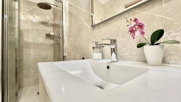 Exclusive Apartment, 1 Bedroom, Terrace | Bathroom | Shower, rainfall showerhead, free toiletries, hair dryer