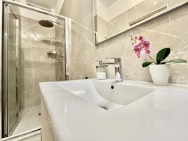 Exclusive Apartment, 1 Bedroom, Terrace | Bathroom | Shower, rainfall showerhead, free toiletries, hair dryer