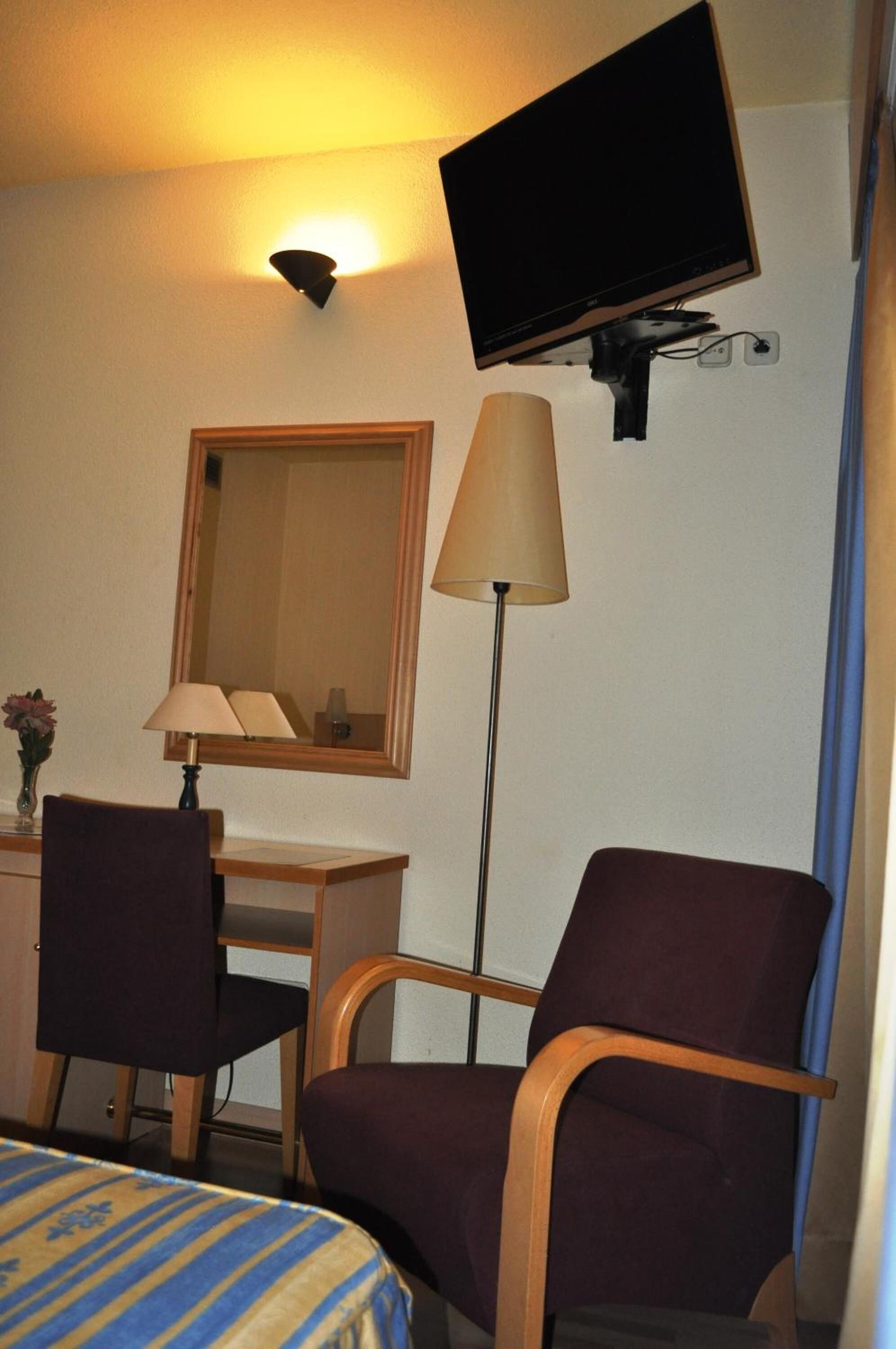 desk, blackout curtains, iron/ironing board, free cots/infant beds