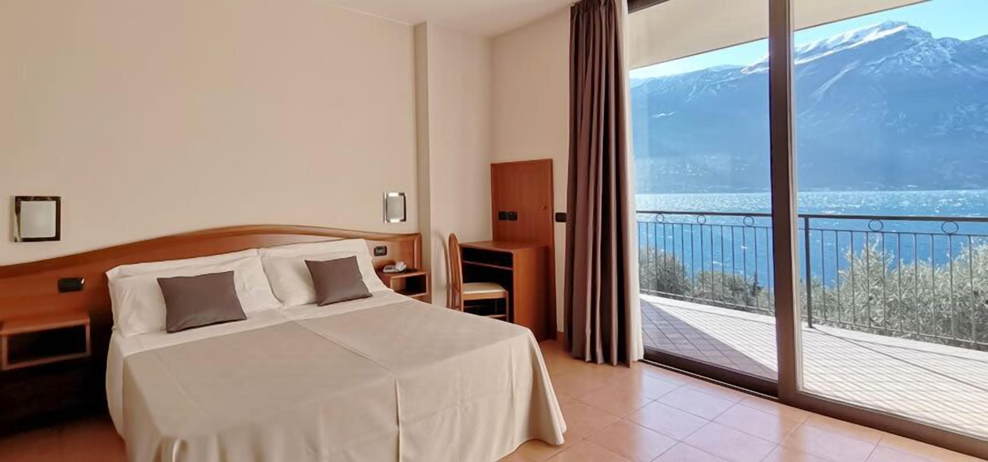 double room, balcony, lake view | minibar, in-room safe, desk, blackout curtains