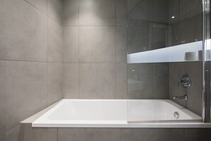 Apartment, 1 Bedroom | Bathroom | Combined shower/tub, free toiletries, hair dryer, slippers