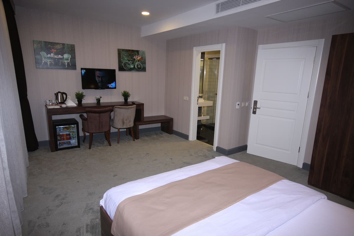 أغطية فراش متميزة ومأكولات ومشروبات مجانية في الميني بار