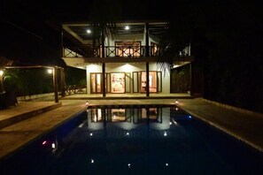 A two-story building with a swimming pool in front. - Tamani Villas (Matemwe)