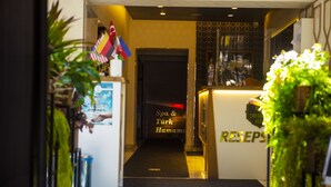 A hotel reception area with a reception desk, a sign for 'Spa & Turkish Hamam', and a 'RESERVES' sign. - Can Grand Hotel  (Ankara)
