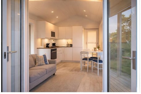 Deluxe Cabin | Private kitchen | Coffee/tea maker, cleaning supplies. Evedals Camping