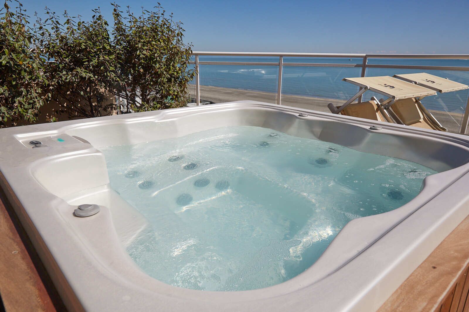 A hot tub with a view of the ocean.