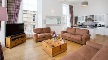 Apartment, 4 Bedrooms | Living area | Flat-screen TV