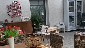 A breakfast setup with a table set for two, including plates, cups, a coffee pot, and a fruit bowl. - Les Mayombes (Roquebrune-sur-Argens)