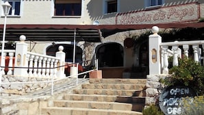A building with a sign reading "Rincon de Pepe." - Rincón de Pepe (El Castell de Guadalest)