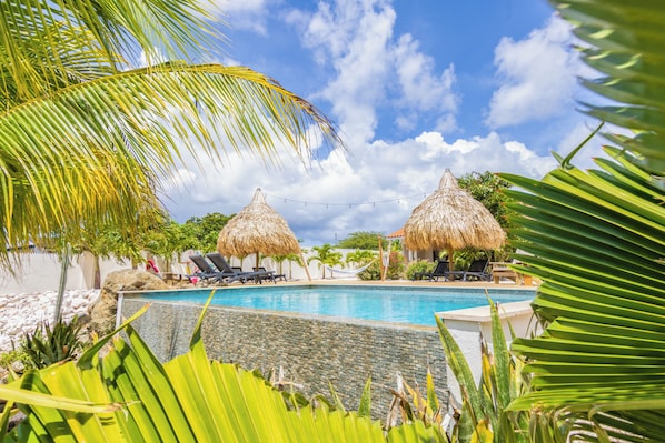 2 outdoor pools, pool umbrellas, pool loungers