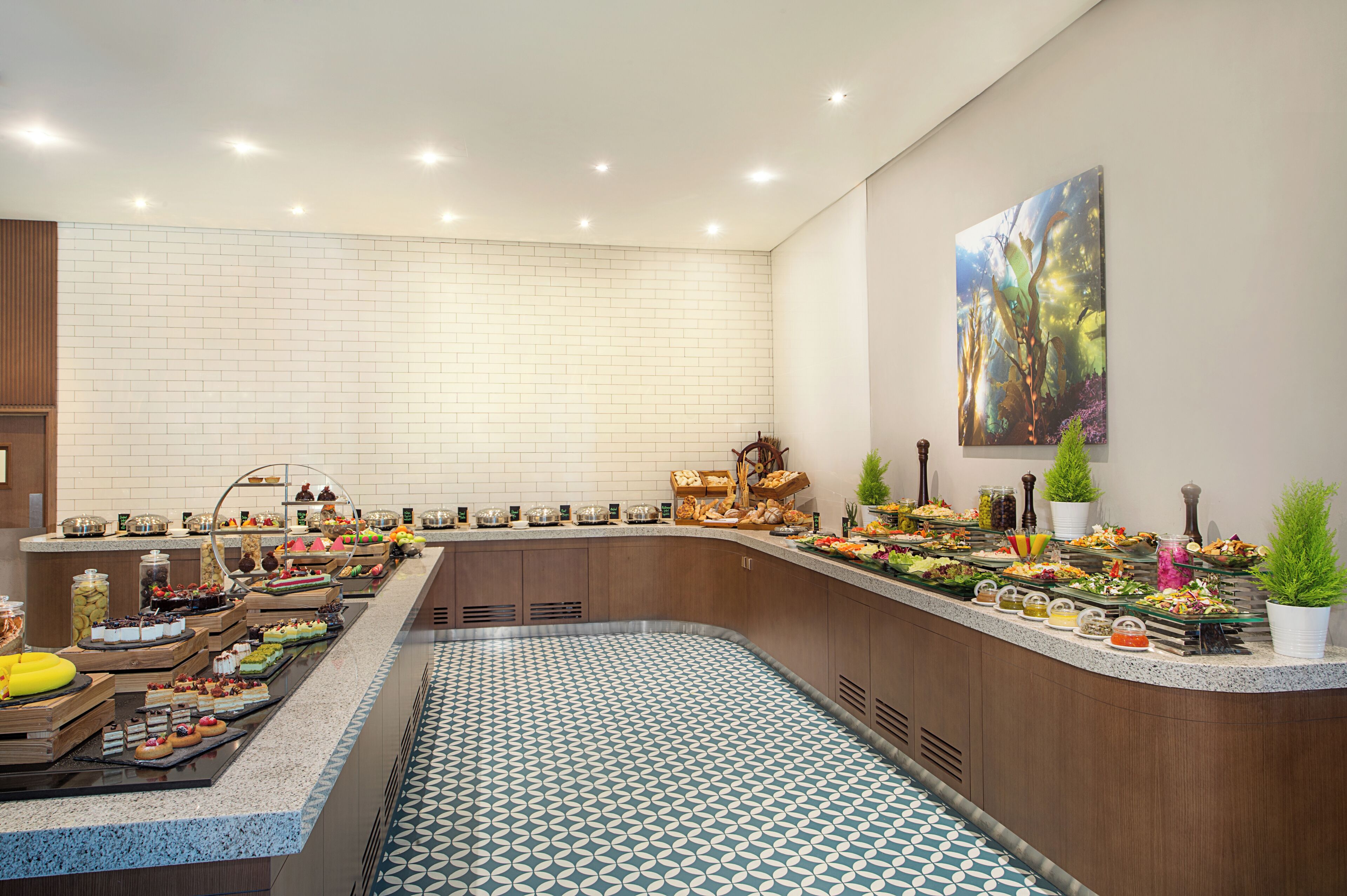 A buffet with various food items and a patterned floor.
