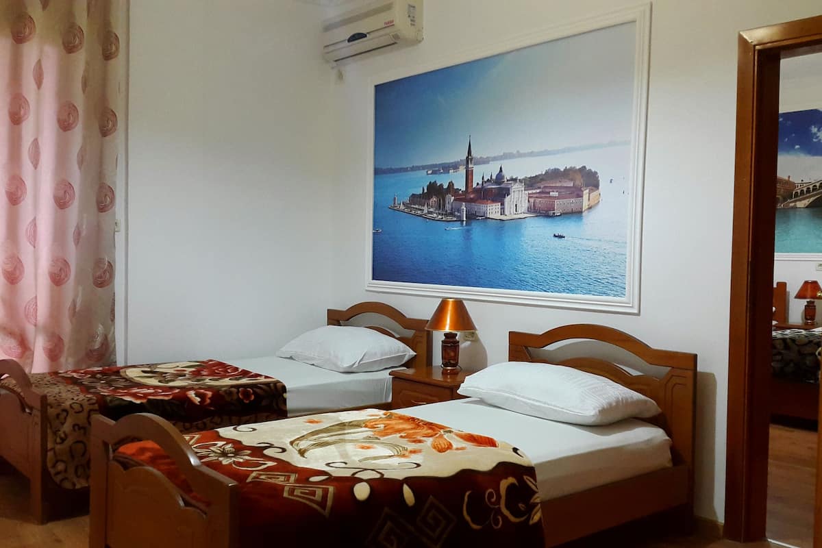 Family Suite, Multiple Beds, Connecting Rooms, River View | In-room safe, iron/ironing board, free WiFi, bed sheets