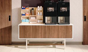 A kitchen counter with two coffee makers and various kitchen items. - Holiday Inn Express & Suites Alachua - Gainesville Area by IHG (Alachua)