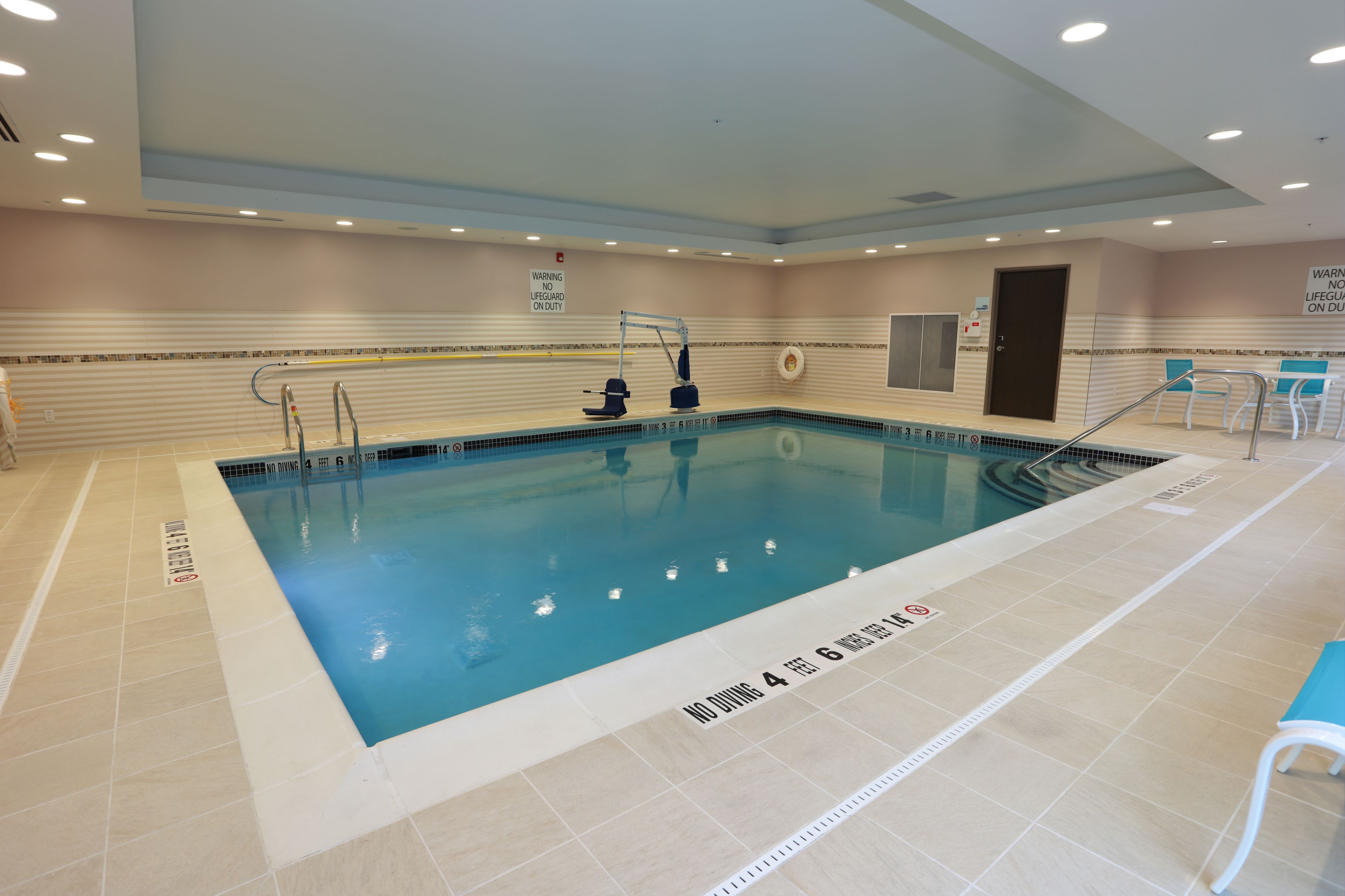 indoor pool, open 7:00 am to 10:00 pm, pool loungers