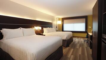 A hotel room with two beds, a large window, and a minibar.