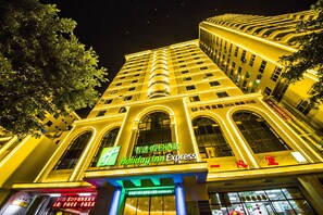 A multi-story hotel with a prominent 'Holiday Inn Express' sign. - Holiday Inn Express Sanya Bay by IHG (Sanya)