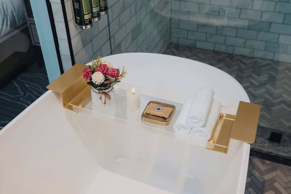 pender suite - dividend floor | bathroom | designer toiletries, hair dryer, bathrobes, slippers