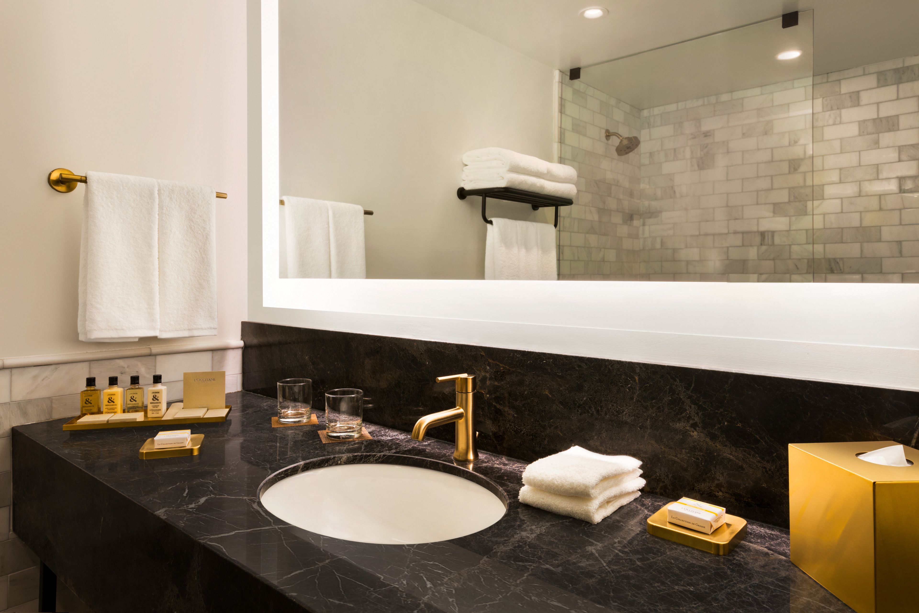 designer toiletries, hair dryer, bathrobes, slippers