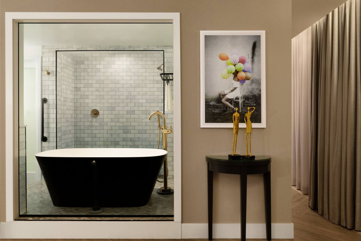 patio suite - dividend floor | bathroom | designer toiletries, hair dryer, bathrobes, slippers