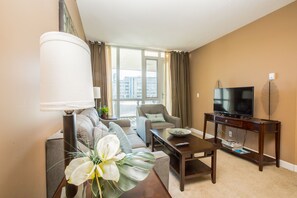 Suite, 2 Queen Beds | Living room | Flat-screen TV - Suite Digs Riverfront (Calgary)